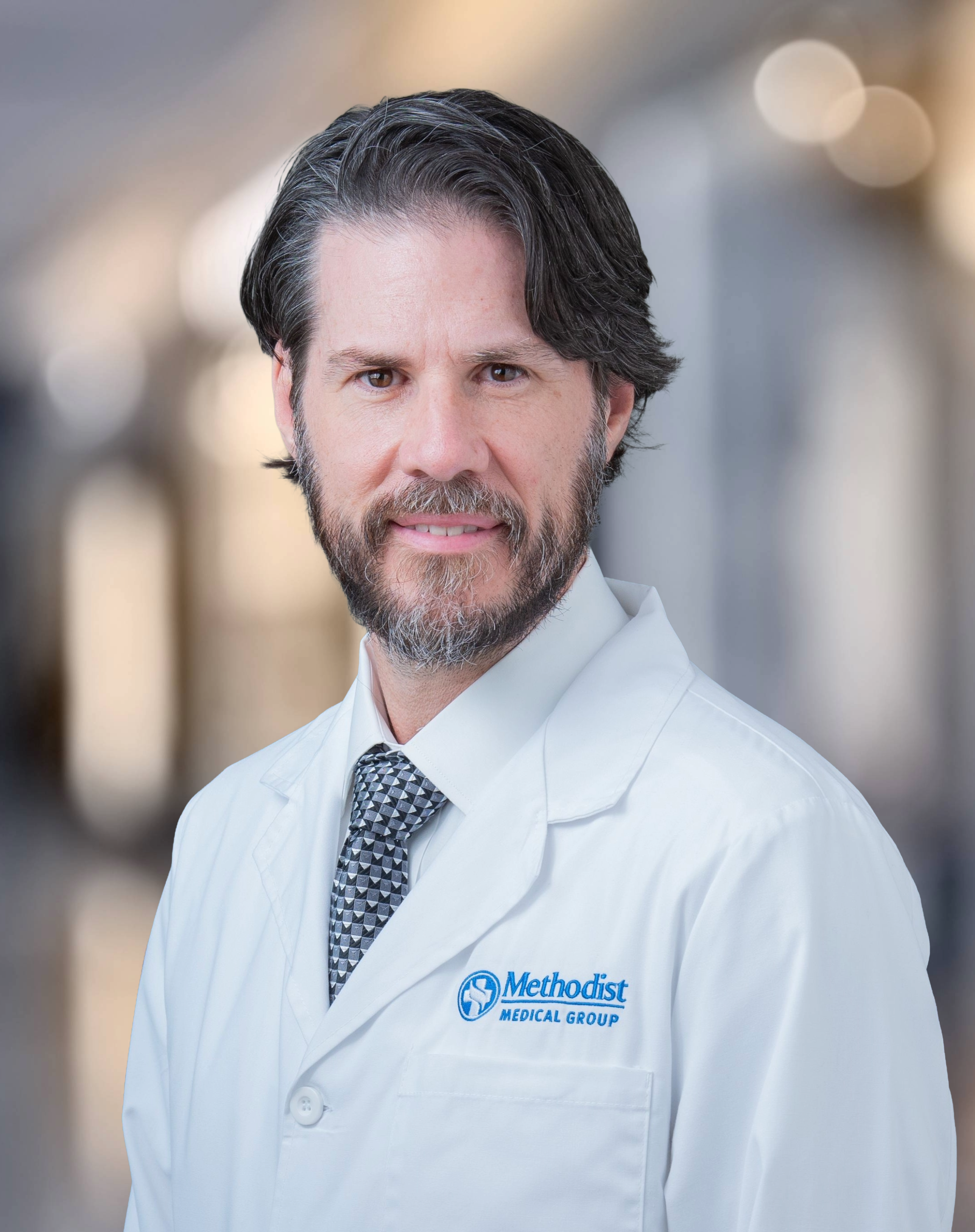 A portrait of Samuel Barnett, MD, FAANS